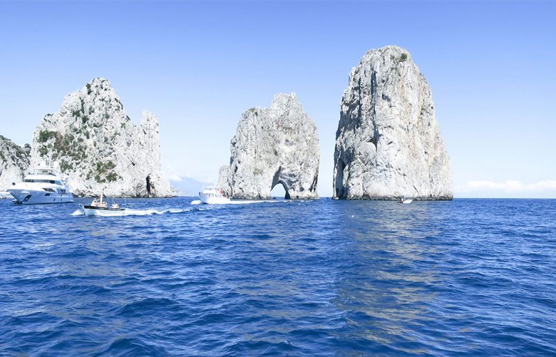 Blue Grotto a cove in Capri, Italy electric blue water