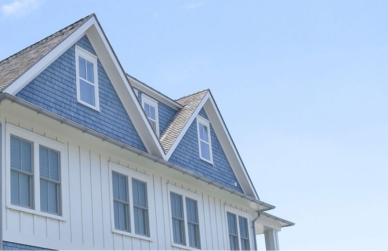 Coastal Architecture mixed siding blue shingles white paneling